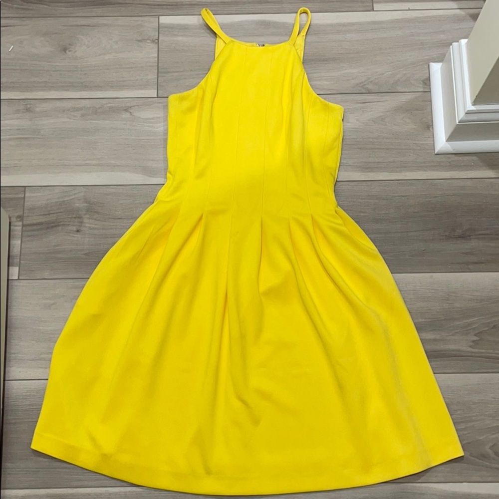 Yellow swing dress with exposed gold back zipper